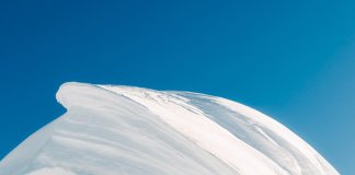 captures the snow-blanketed summit of Chopicalqui in Peru, a majestic peak stand… captures the snow-blanketed summit of Chopicalqui in Peru, a majestic peak stand...