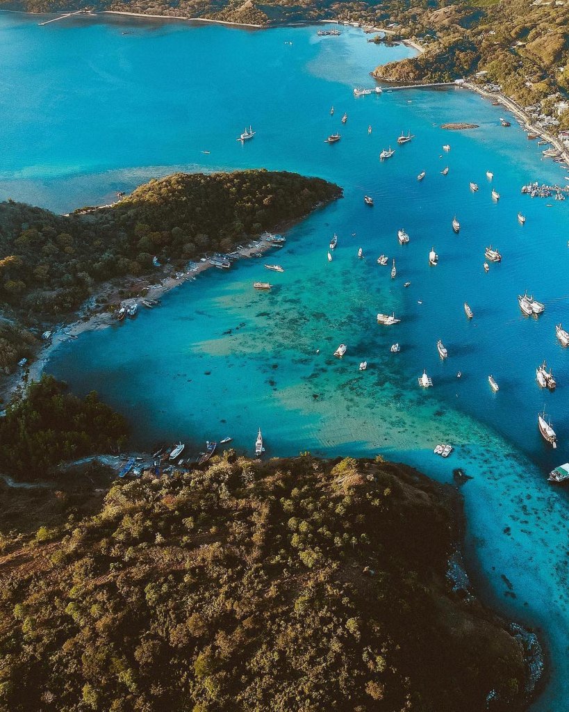 Feast your eyes upon the beauty of Labuan Bajo's marina and let the vibrant colo...